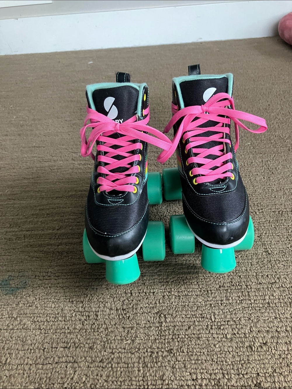 Kids Black Roller Skates with Pink Laces and Green Wheels